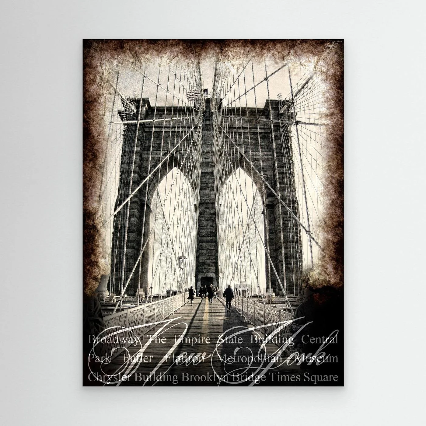 Vintage fine art print of New York City of Brooklyn Bridge with a textured sepia background and elegant typography of NYC landmarks, framed and ready to hang.