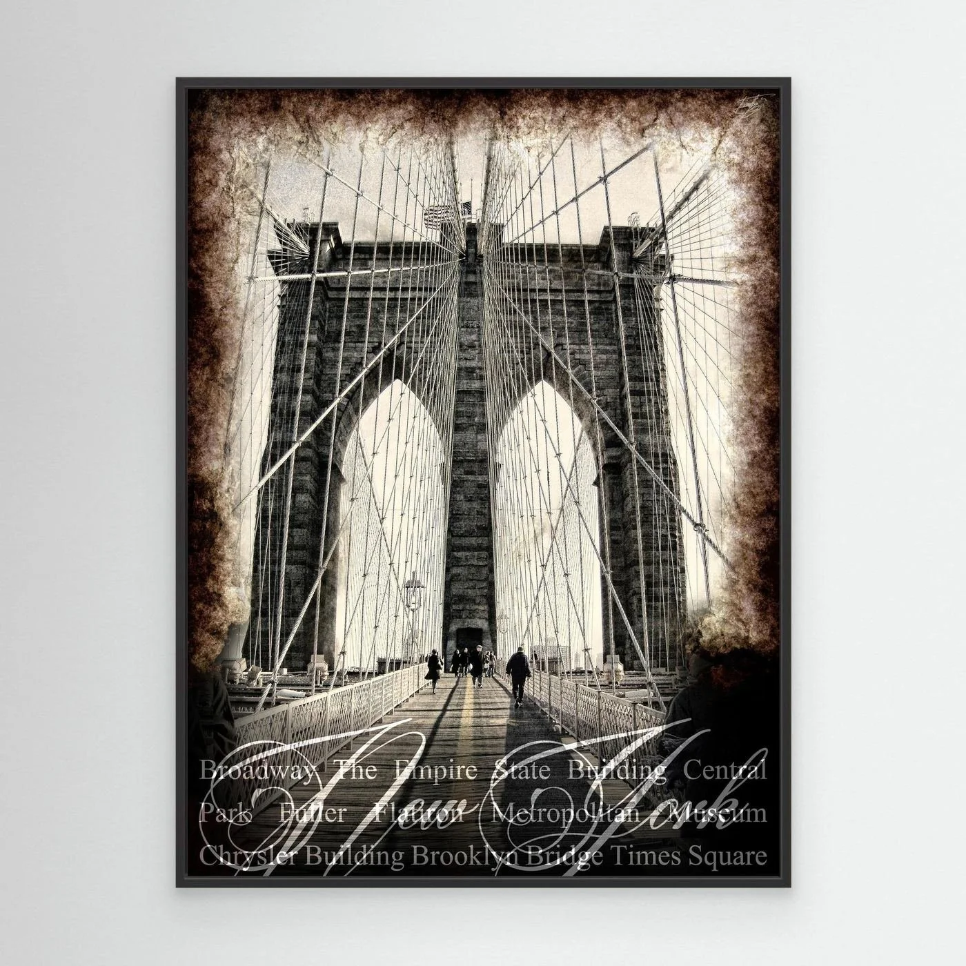 Vintage fine art print of New York City of Brooklyn Bridge with a textured sepia background and elegant typography of NYC landmarks, framed and ready to hang. With black frame