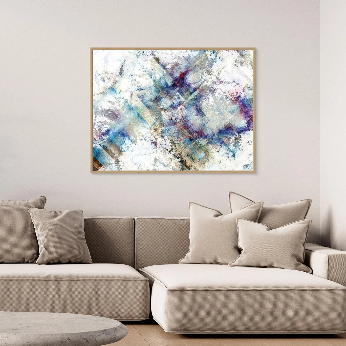 Abstract fine art print featuring weathered watercolor textures and subtle geometric patterns in blue, purple, and beige tones on a bright white background, framed and ready to hang. Over grey sofa