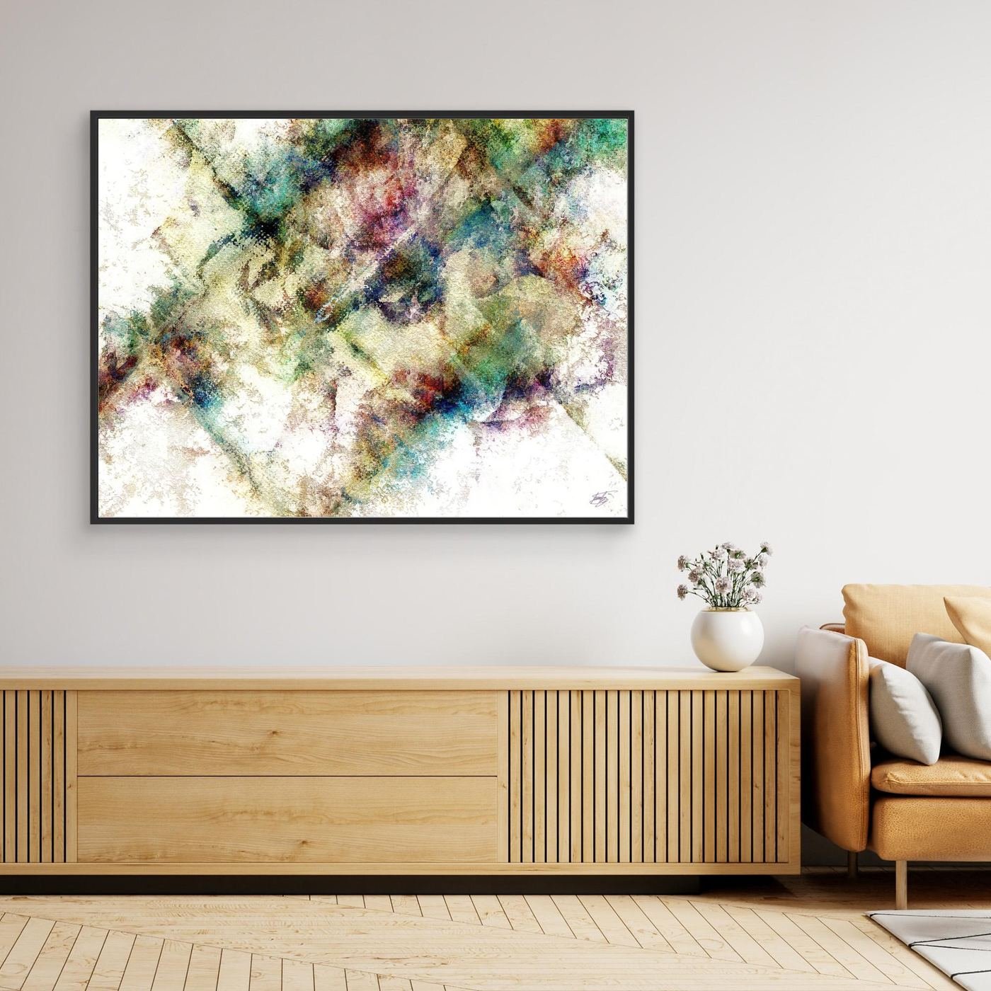 Abstract fine art print with heavy distressed textures and geometric overlays in green, gold, and burgundy tones on a bright background, framed and ready to hang. Over wooden console
