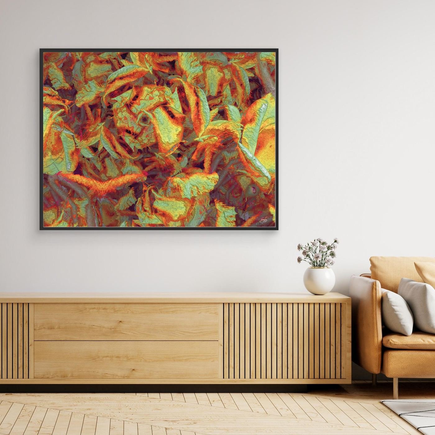 Abstract fine art print showcasing a dense, highly textured pattern of organic leaf-like shapes in warm autumn tones of orange, gold, and sage green, framed and ready to hang. Over wooden console