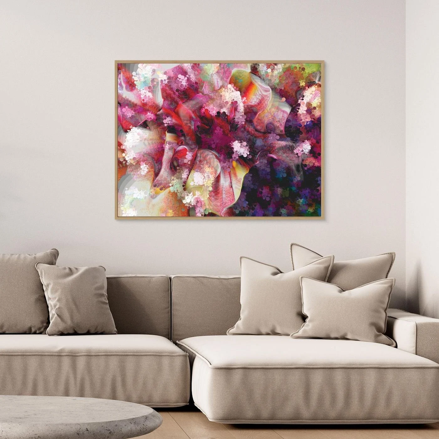 Vibrant abstract fine art print featuring pink, purple, and red floral textures, framed and ready to hang. Over grey couch