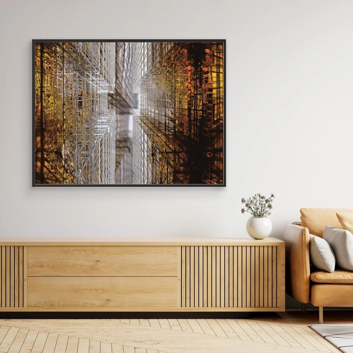 Abstract fine art print showing a dramatic top-down perspective of intricate geometric grid structures in industrial gold and silver tones, framed and ready to hang. Over wooden console