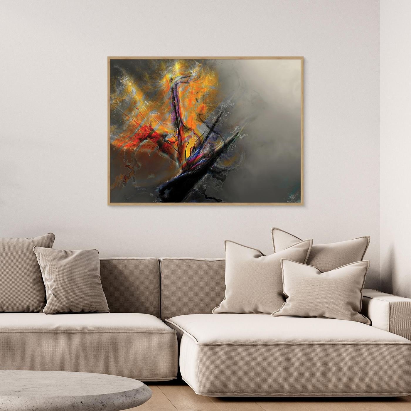 Abstract fine art print with dramatic explosion of textured orange, yellow, and red fiery shapes contrasting against a smoky gray background, framed and ready to hang. Over grey couch