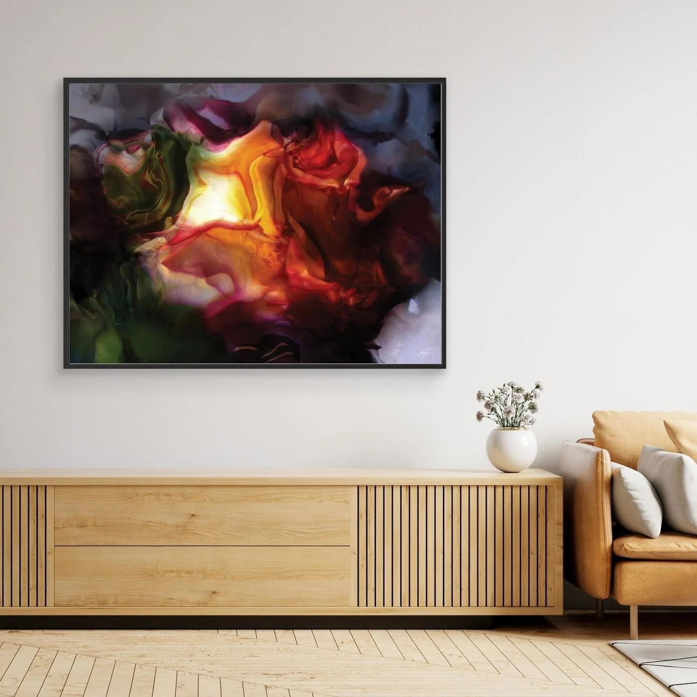 Moody abstract fine art print with a glowing translucent floral shape in fiery orange, deep red, and dark green tones surrounded by smoky textures, framed and ready to hang. Over wooden console
