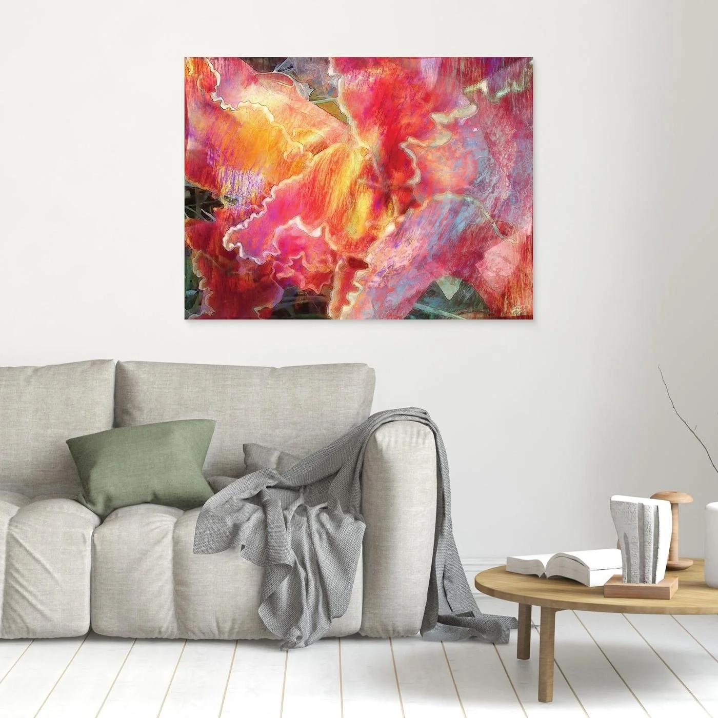 Abstract fine art print featuring fluid, textured wavy edges in vibrant coral pink, orange, and golden yellow with subtle hints of light blue, framed and ready to hang. In living room