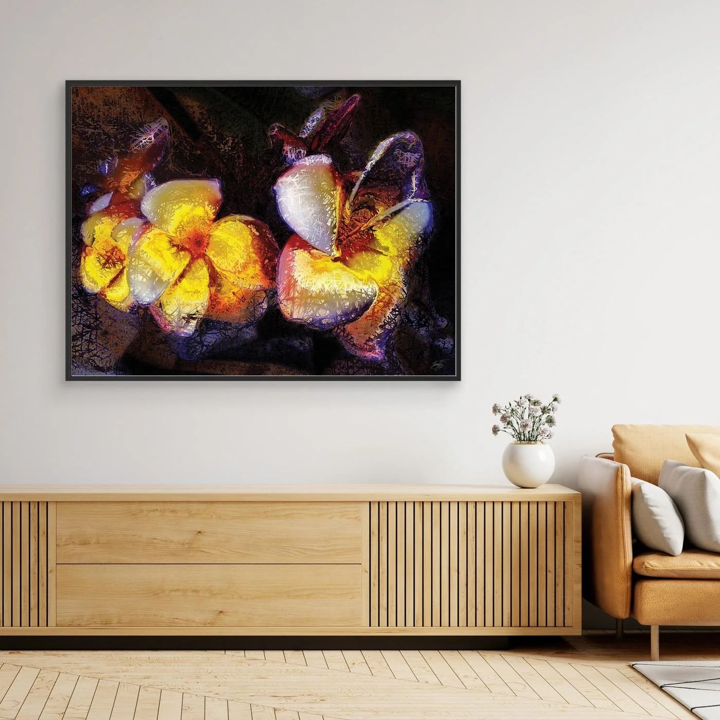 Abstract fine art print featuring textured glowing frangipani plumeria flowers in yellow and orange tones against a dark, moody background, framed and ready to hang. Over wooden console