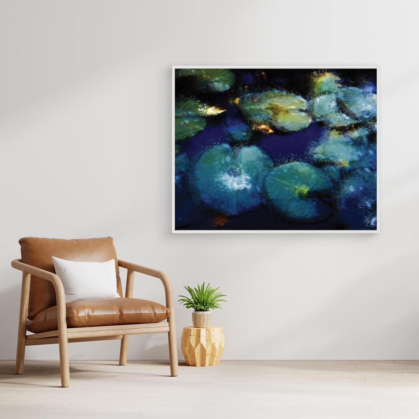 Abstract fine art print evoking a serene pond with lily pads in deep blue, teal, and green tones with impressionistic light textures, framed and ready to hang. With chair
