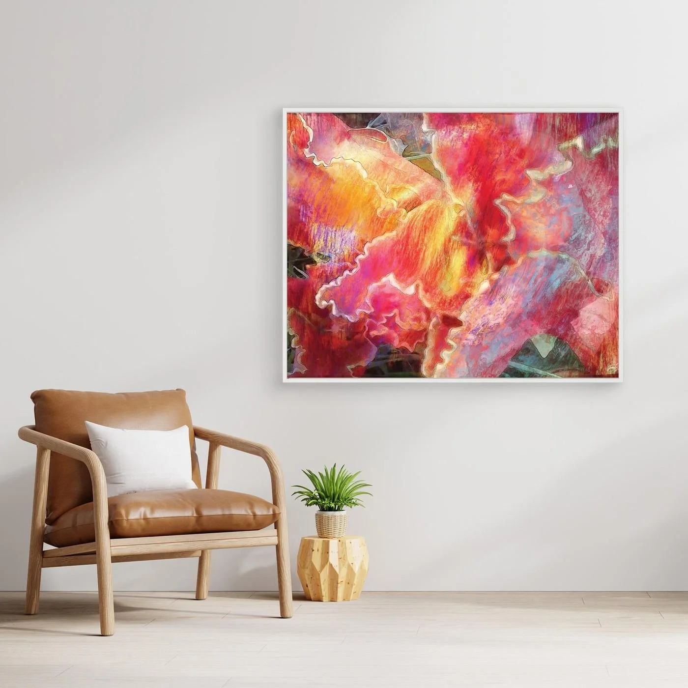 Abstract fine art print featuring fluid, textured wavy edges in vibrant coral pink, orange, and golden yellow with subtle hints of light blue, framed and ready to hang. With chair