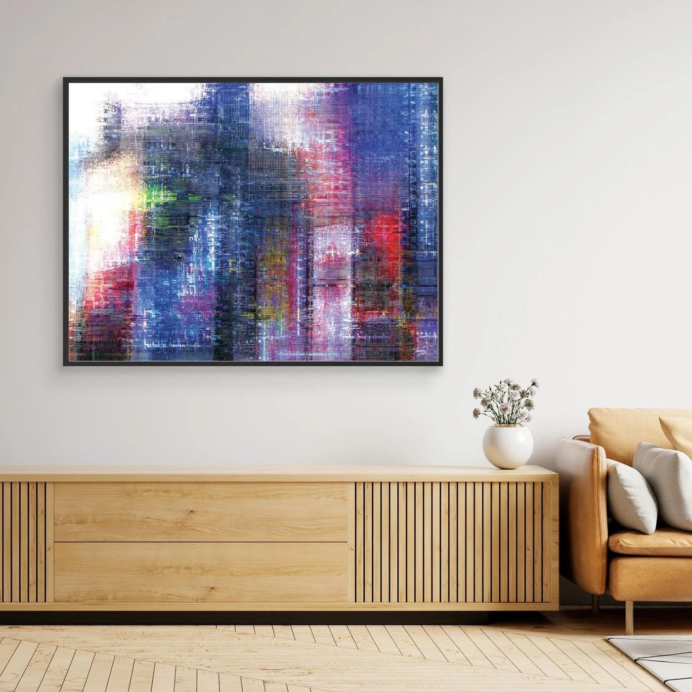 Abstract fine art print evoking a textured city skyline with vertical lines in deep blue, purple, and red tones, framed and ready to hang. Over wooden console