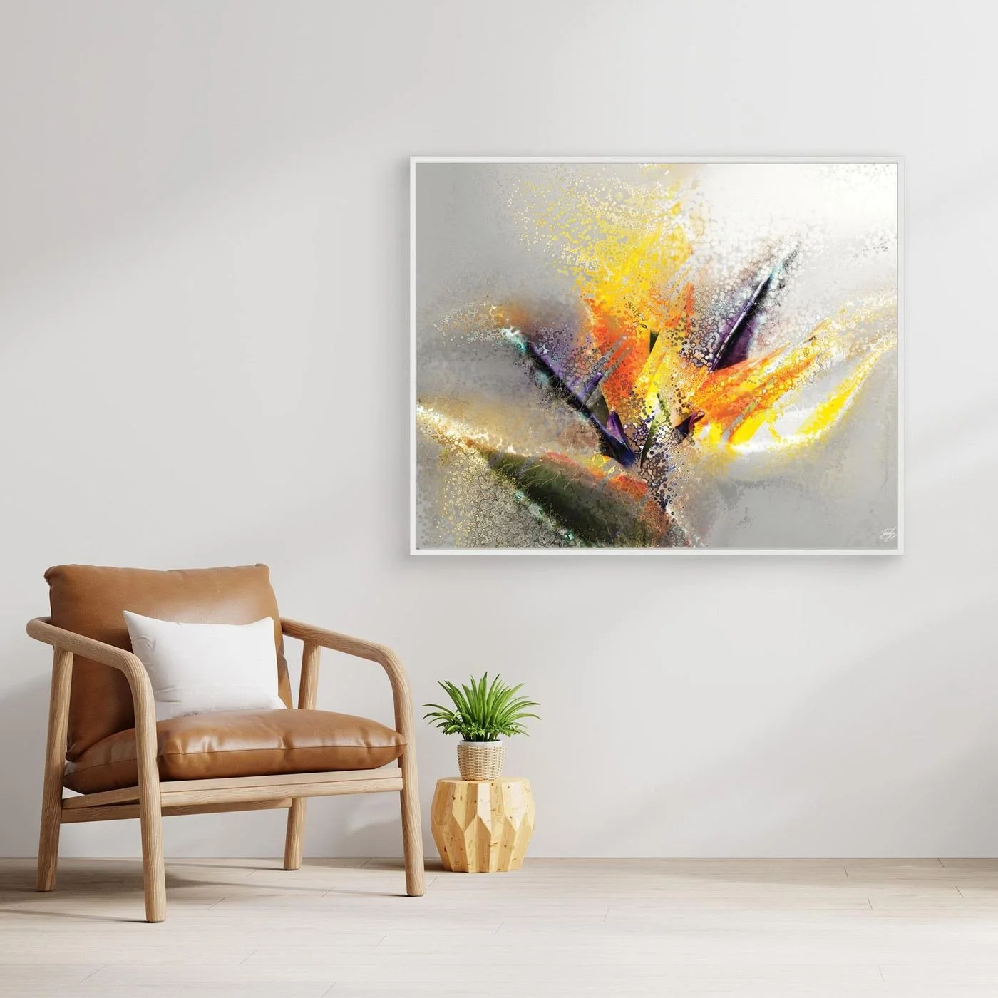 Abstract fine art print evoking an exotic flower with stipple and splash textures in vibrant yellow, orange, and purple over a light gray background, framed and ready to hang. With chair