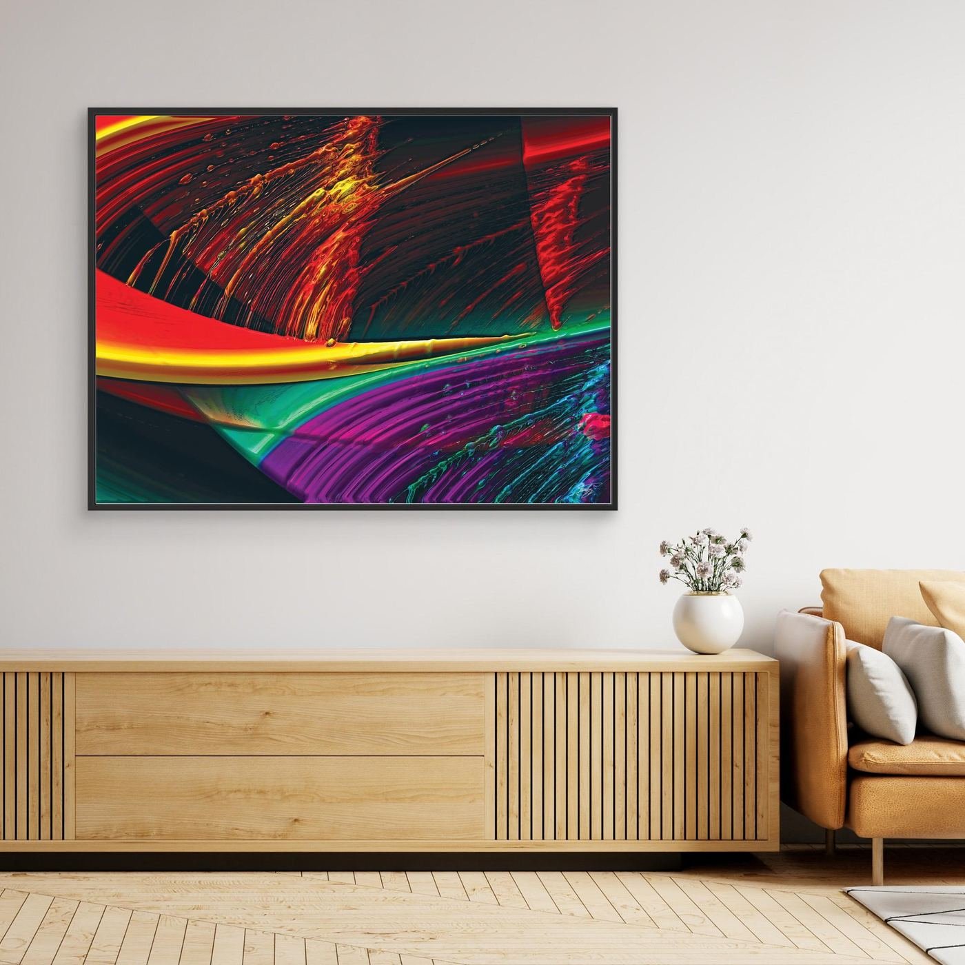 Abstract fine art print with high-gloss liquid textures, showcasing heavy 3D brushstrokes in fiery red, bright yellow, green, and deep purple tones, framed and ready to hang. Over wooden console