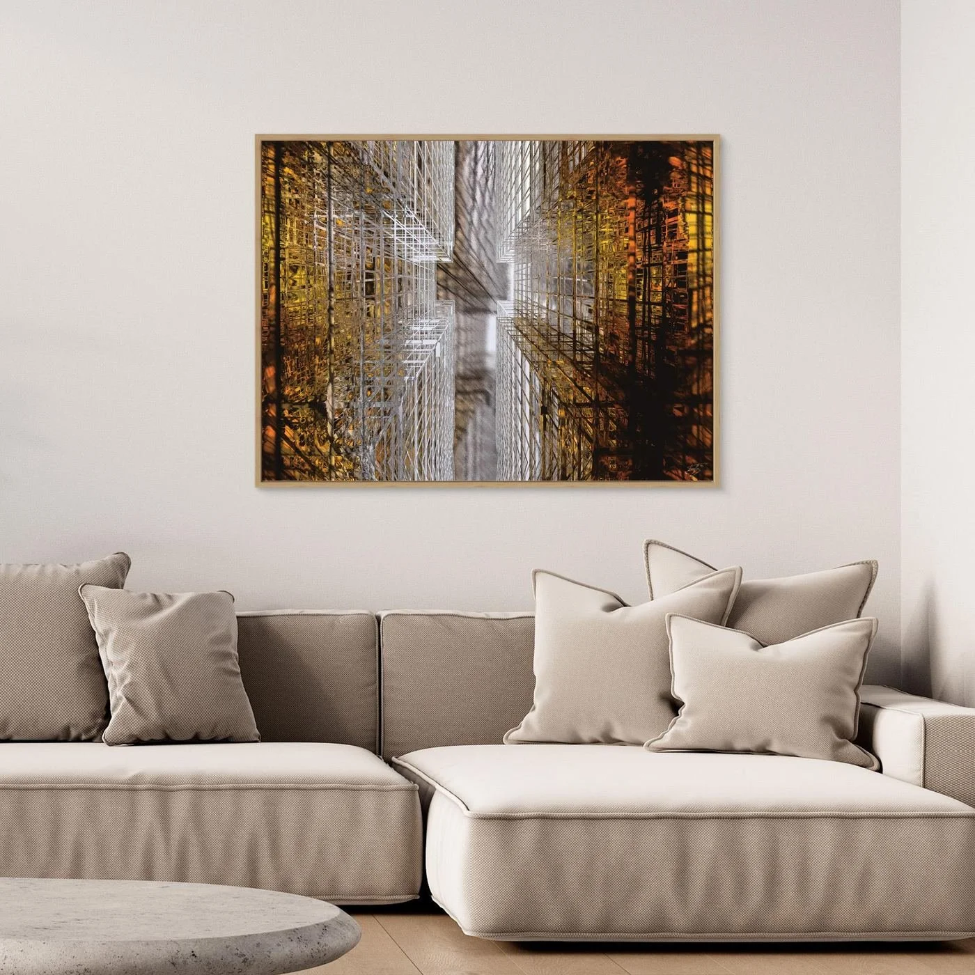 Abstract fine art print showing a dramatic top-down perspective of intricate geometric grid structures in industrial gold and silver tones, framed and ready to hang. Over grey couch