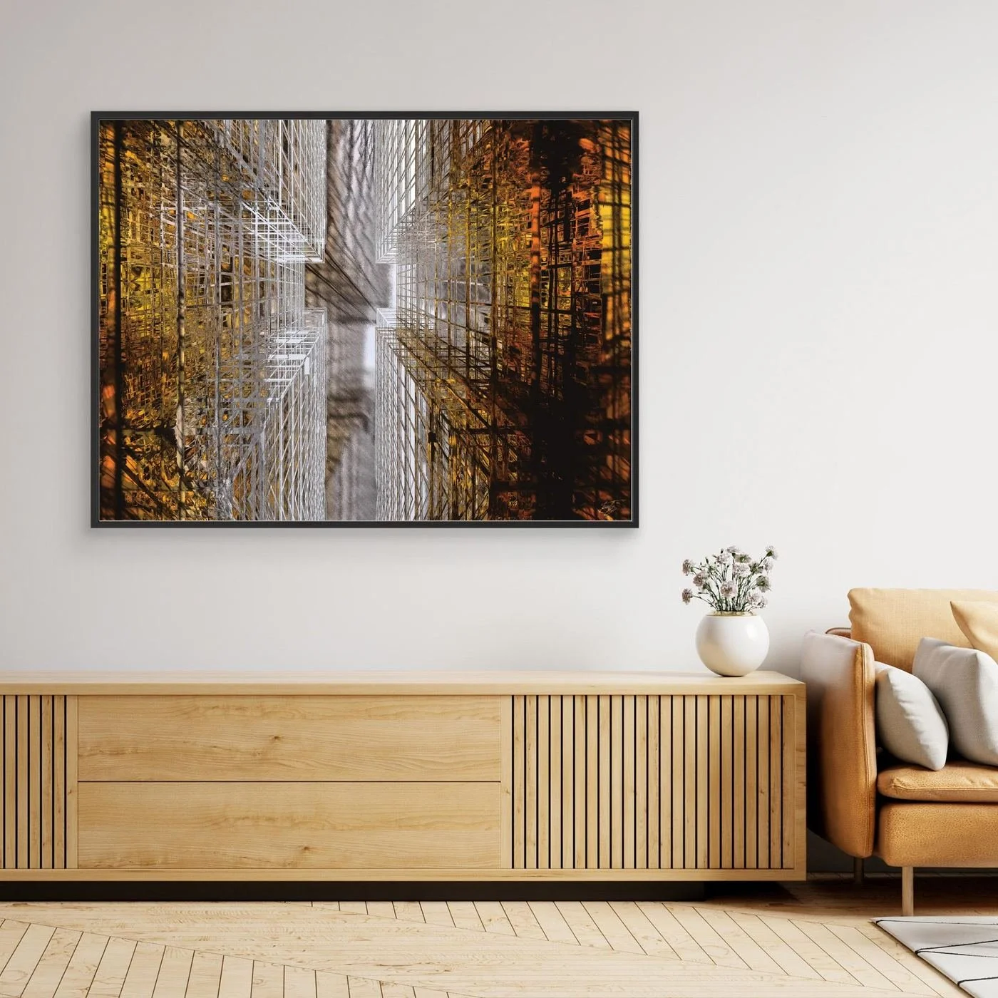Abstract fine art print showing a dramatic top-down perspective of intricate geometric grid structures in industrial gold and silver tones, framed and ready to hang. Over wooden console