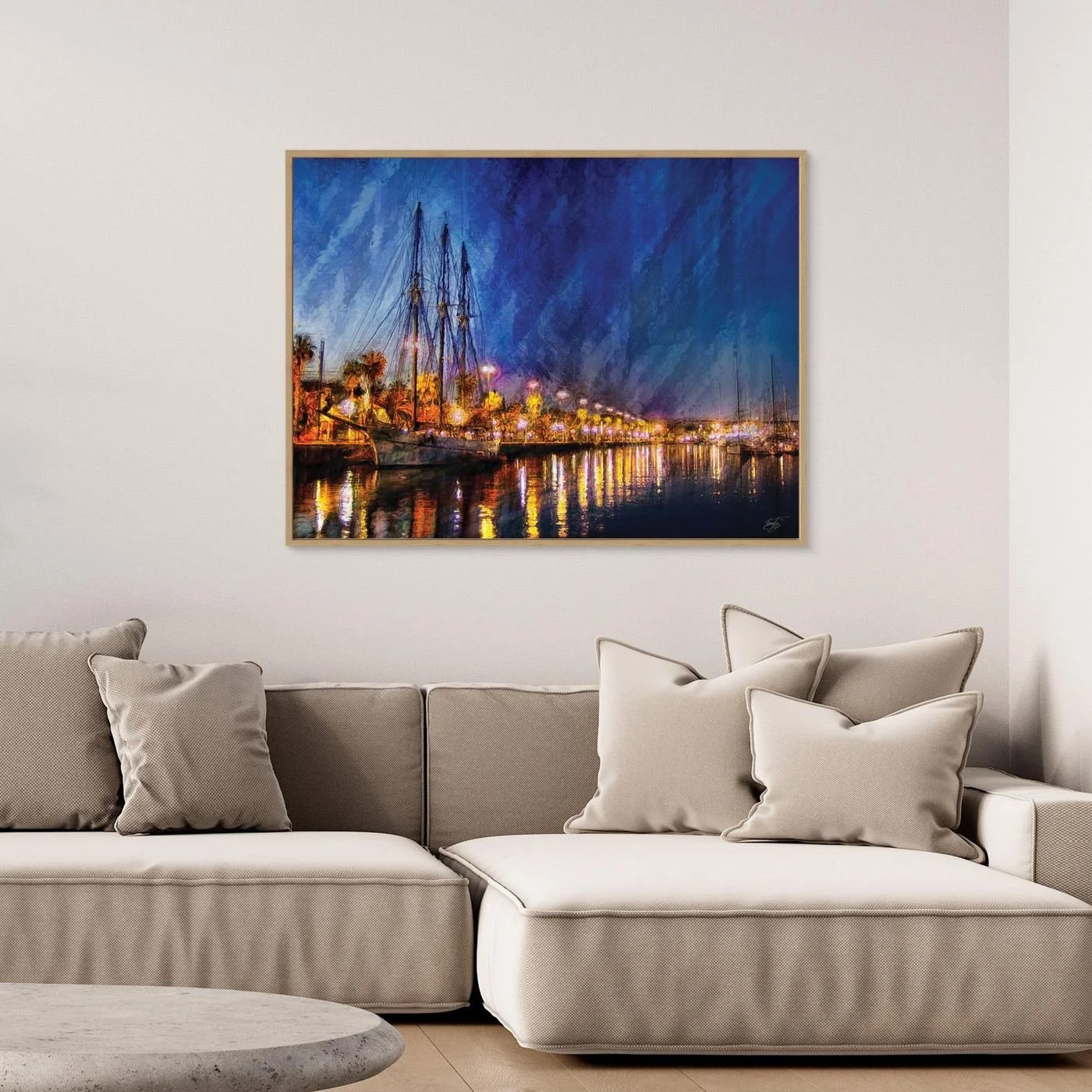 Expressionist fine art of a night landscape of Port Vell in Barcelona, with a sailboat, palm trees, illuminated street lamps, and reflections on water, framed and ready to hang. Over grey couch