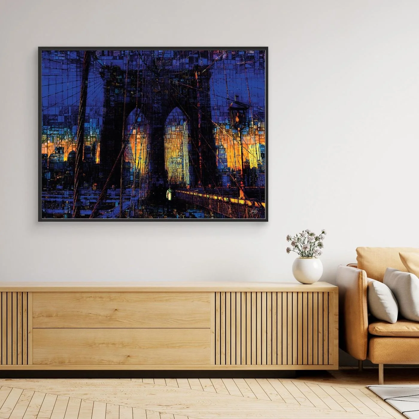 Abstract fine art print of the Brooklyn Bridge at sunset featuring a complex mosaic and pixelated texture in deep blue and vibrant golden tones, framed and ready to hang. Over wooden couch