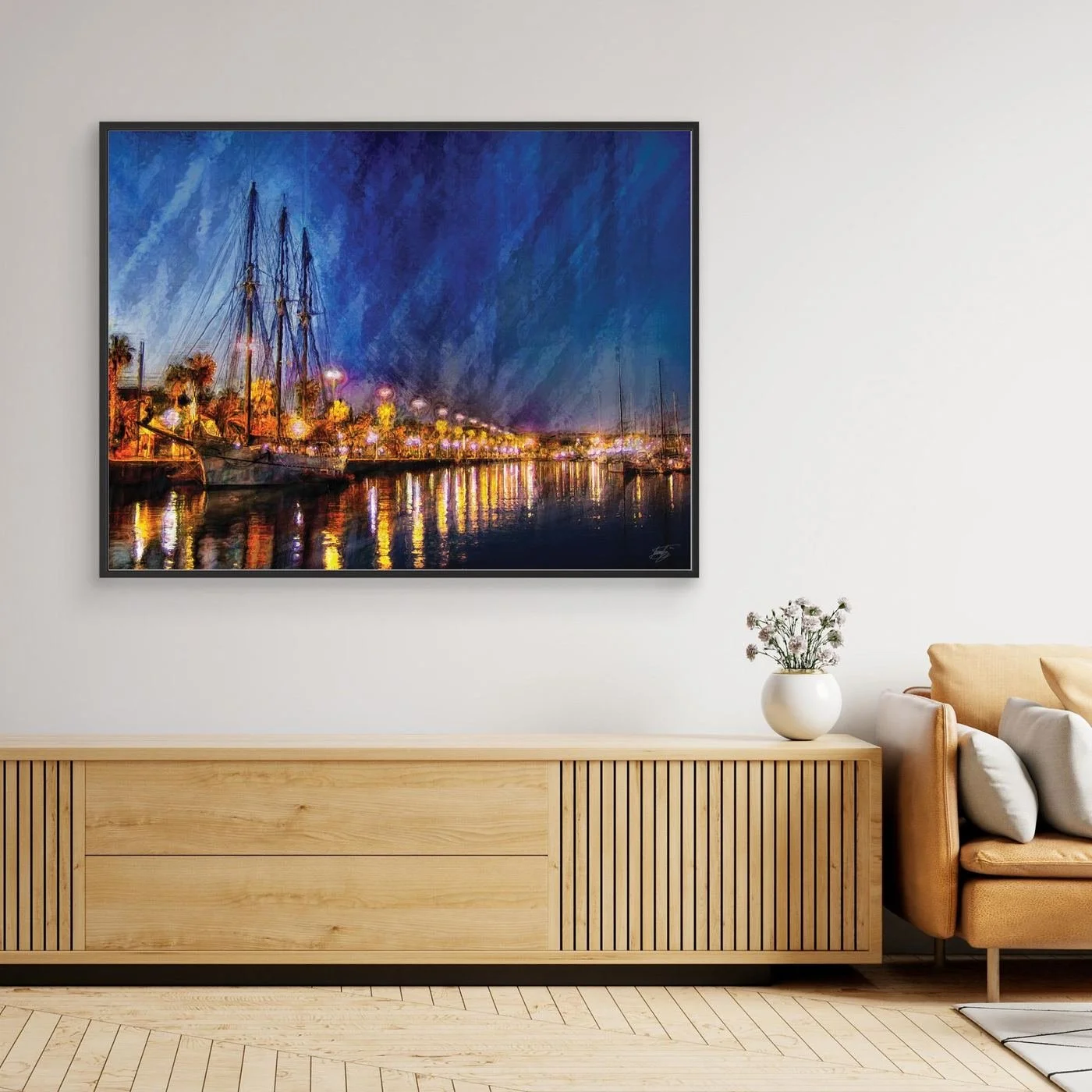 Expressionist fine art of a night landscape of Port Vell in Barcelona, with a sailboat, palm trees, illuminated street lamps, and reflections on water, framed and ready to hang. Over wooden console