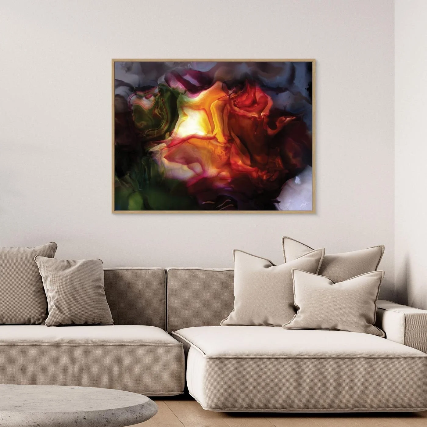Moody abstract fine art print with a glowing translucent floral shape in fiery orange, deep red, and dark green tones surrounded by smoky textures, framed and ready to hang. Over grey couch