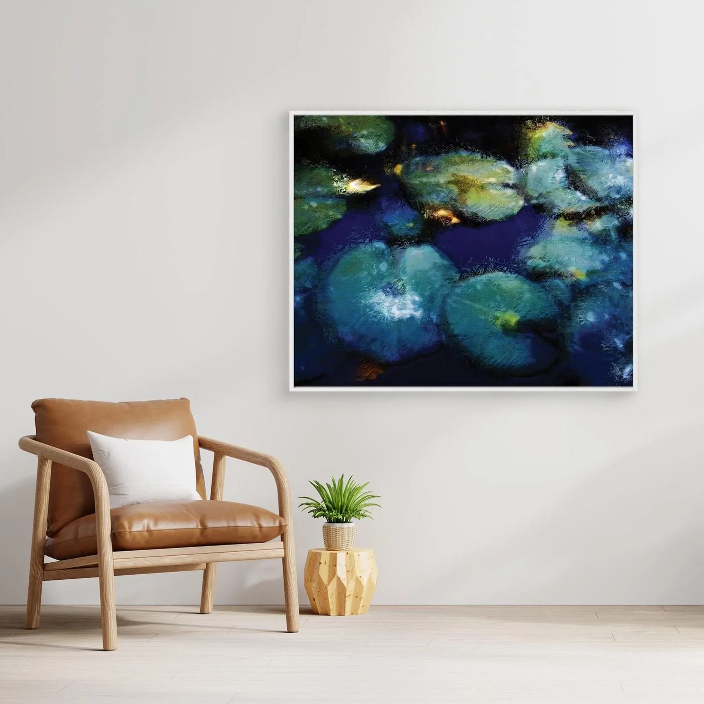Abstract fine art print evoking a serene pond with lily pads in deep blue, teal, and green tones with impressionistic light textures, framed and ready to hang. With chair