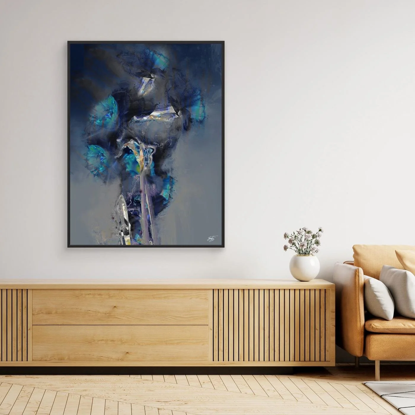 Moody abstract fine art print showcasing ethereal translucent flowers in deep navy blue, teal, and glowing turquoise tones over a smoky gray background, framed and ready to hang. Over wooden console