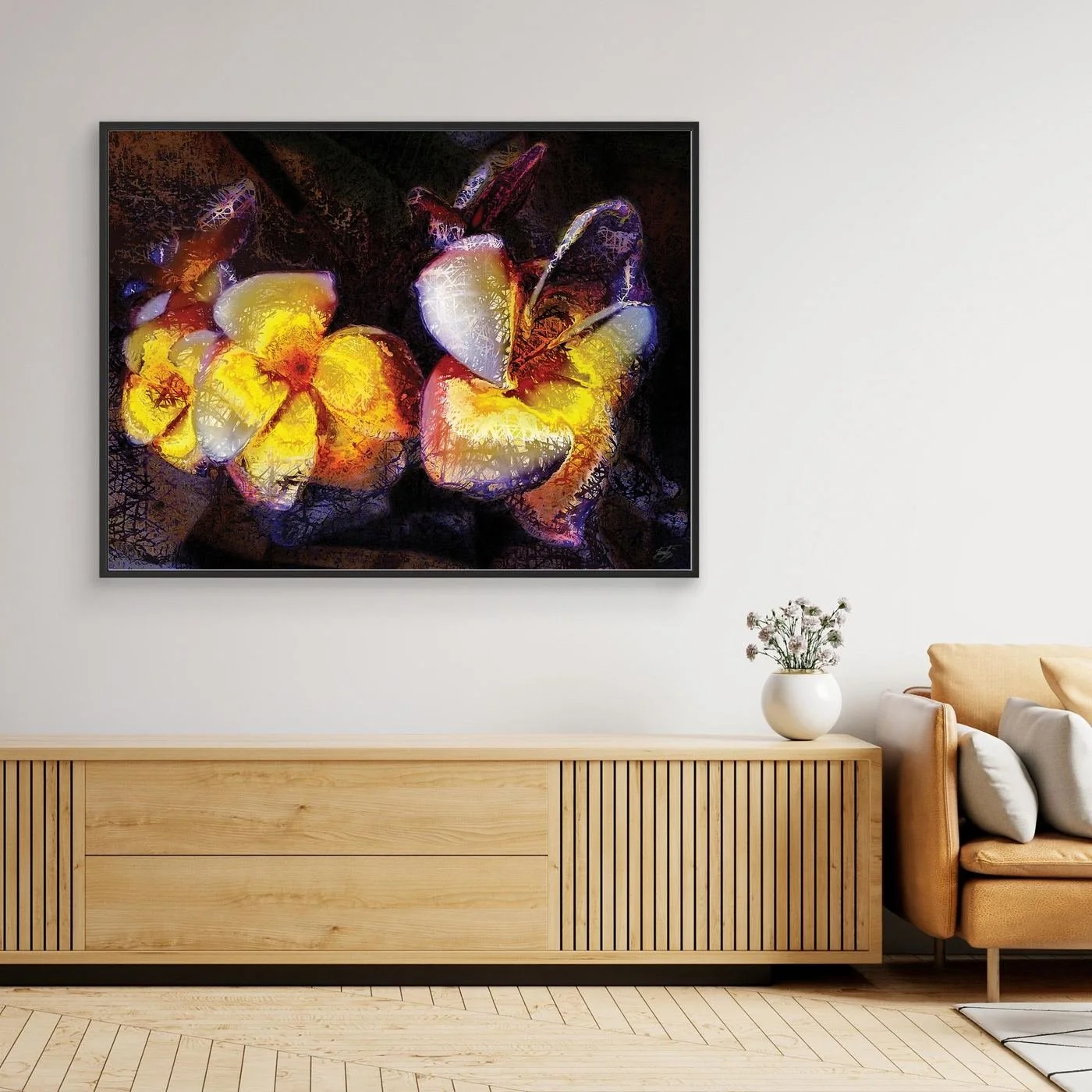 Abstract fine art print featuring textured glowing frangipani plumeria flowers in yellow and orange tones against a dark, moody background, framed and ready to hang. Over wooden console