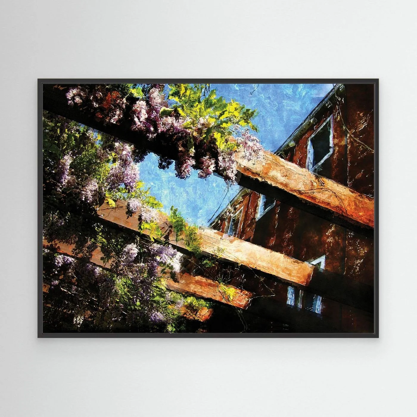Impressionist fine art print showcasing purple wisteria flowers climbing over rustic wooden pergola beams against a textured blue sky, framed and ready to hang. With black frame