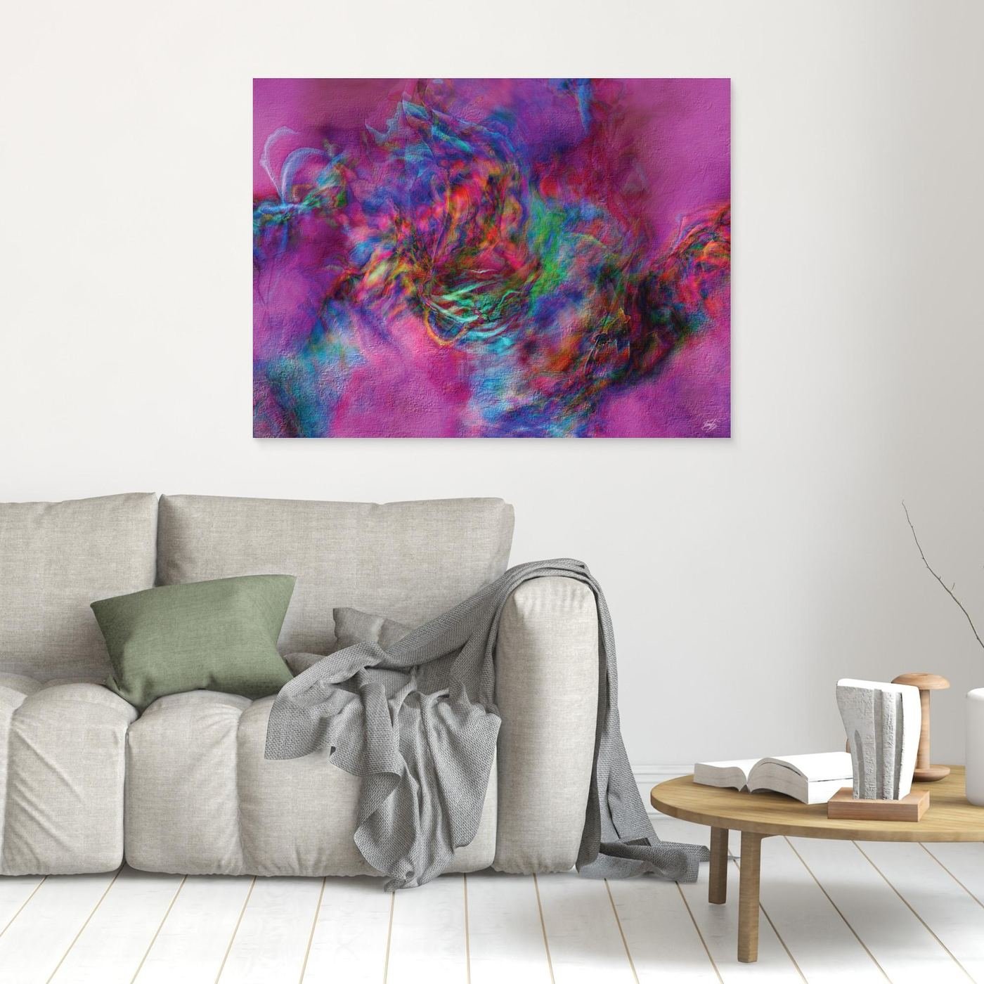 Abstract fine art print with heavy plaster-like texture featuring a vibrant magenta and pink background with a colorful swirling center, framed and ready to hang. In living room