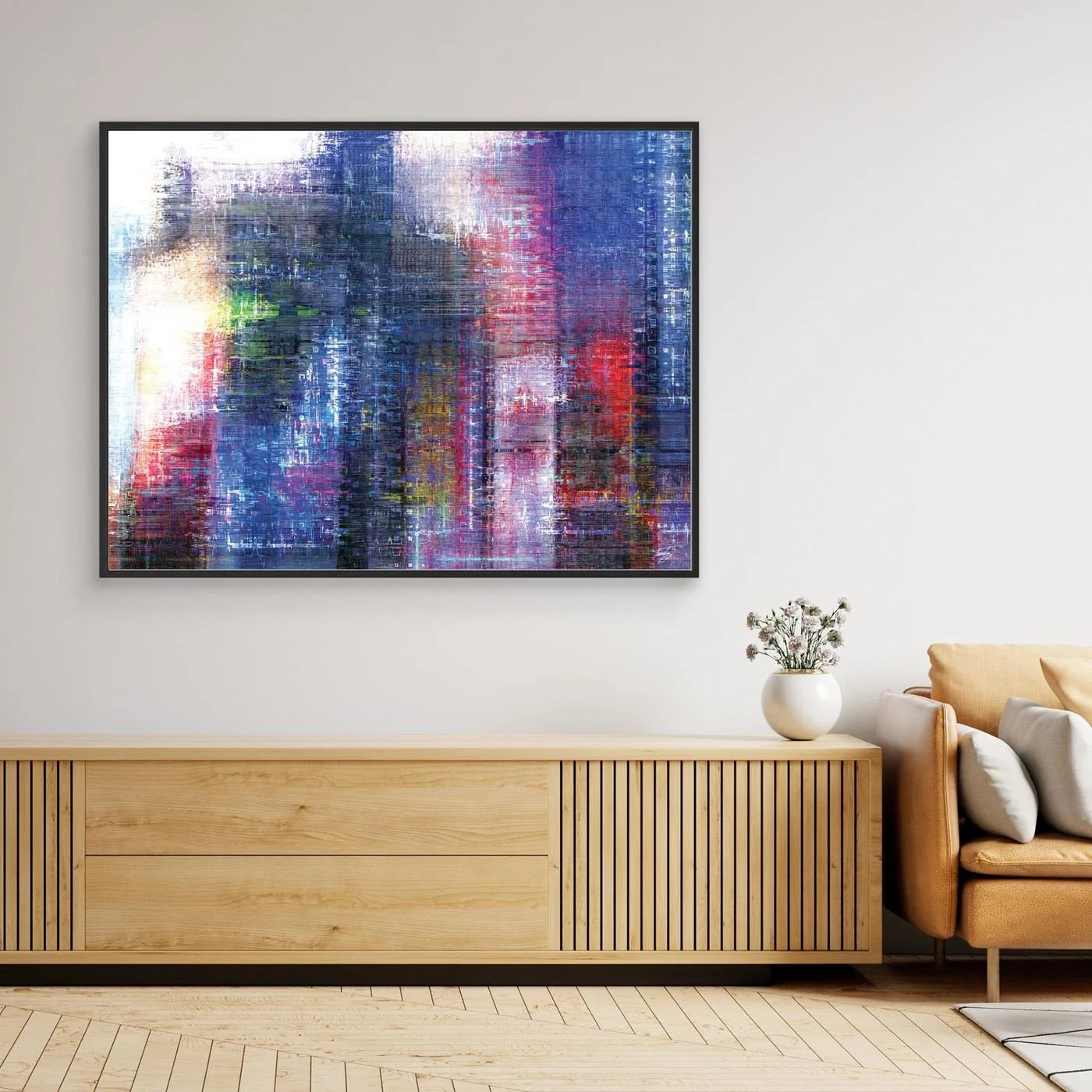 Abstract fine art print evoking a textured city skyline with vertical lines in deep blue, purple, and red tones, framed and ready to hang. Over wooden console