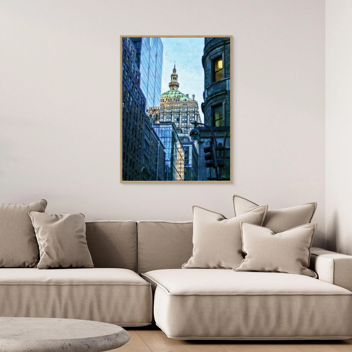 Impressionist art print of a Manhattan street perspective, with an historic building dome framed by modern blue glass skyscrapers, framed and ready to hang. Over grey couch