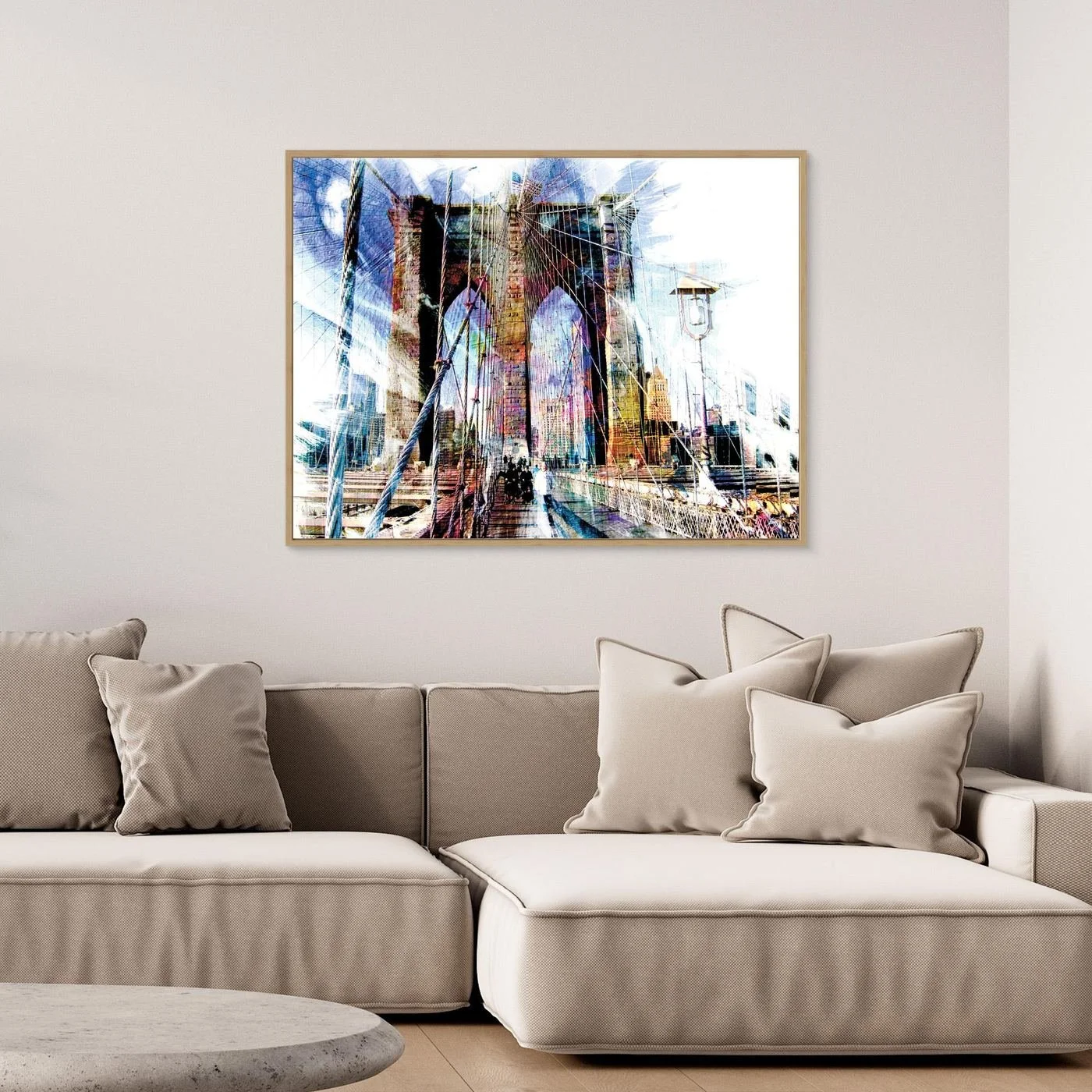 Expressionist fine art print of a dramatic walking perspective of the Brooklyn Bridge with high-contrast architectural line textures and bright highlights, framed and ready to hang. Over grey couch