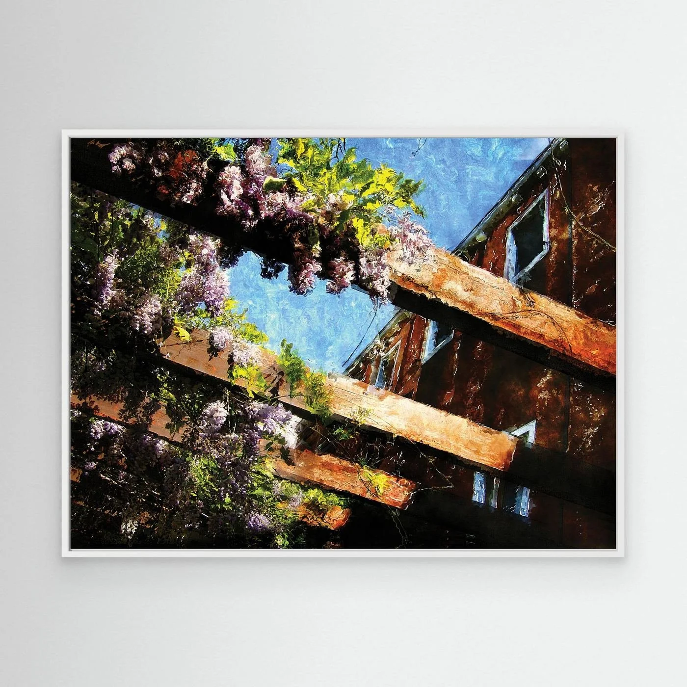 Impressionist fine art print showcasing purple wisteria flowers climbing over rustic wooden pergola beams against a textured blue sky, framed and ready to hang. With white frame