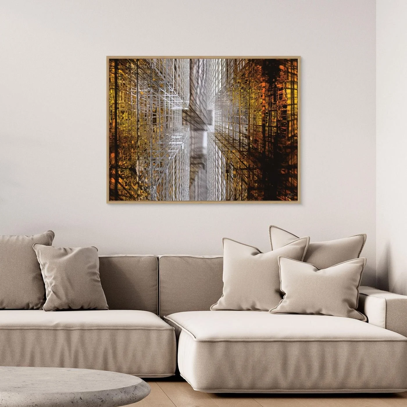 Abstract fine art print showing a dramatic top-down perspective of intricate geometric grid structures in industrial gold and silver tones, framed and ready to hang. Over grey couch