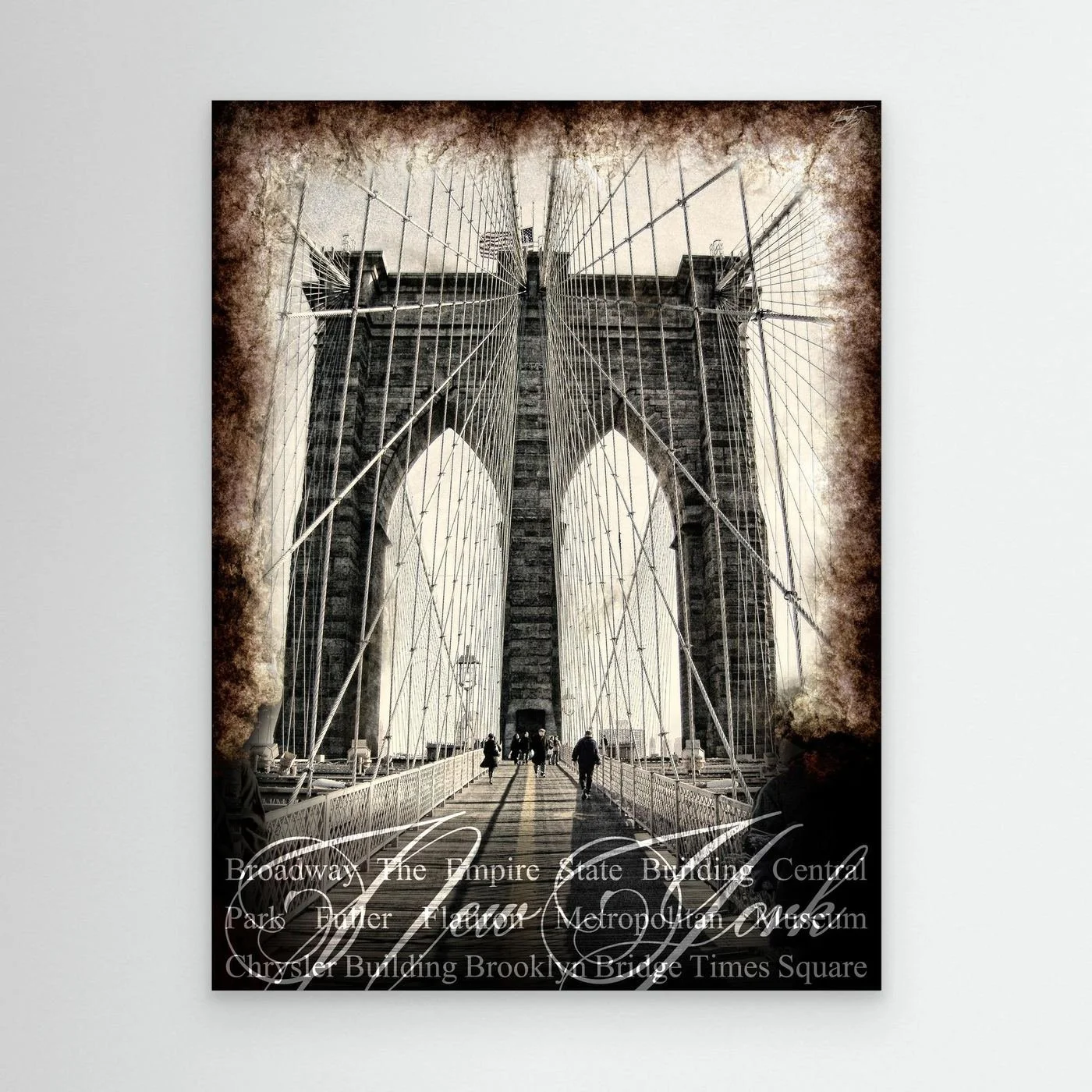Vintage fine art print of New York City of Brooklyn Bridge with a textured sepia background and elegant typography of NYC landmarks, framed and ready to hang.