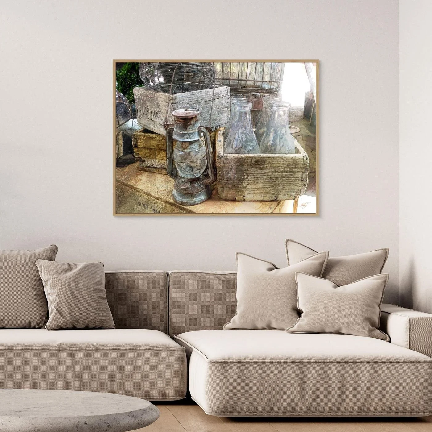 Vintage fine art print of an antique kerosene lantern, glass bottles in a rustic wooden crate, and weathered textures in warm neutral tones, framed and ready to hang. Over grey couch