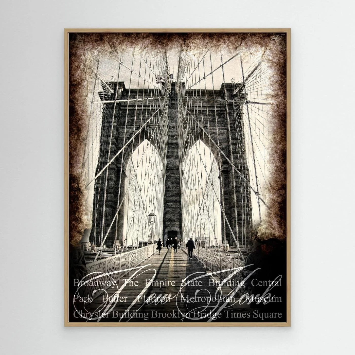 Vintage fine art print of New York City of Brooklyn Bridge with a textured sepia background and elegant typography of NYC landmarks, framed and ready to hang. With wooden frame