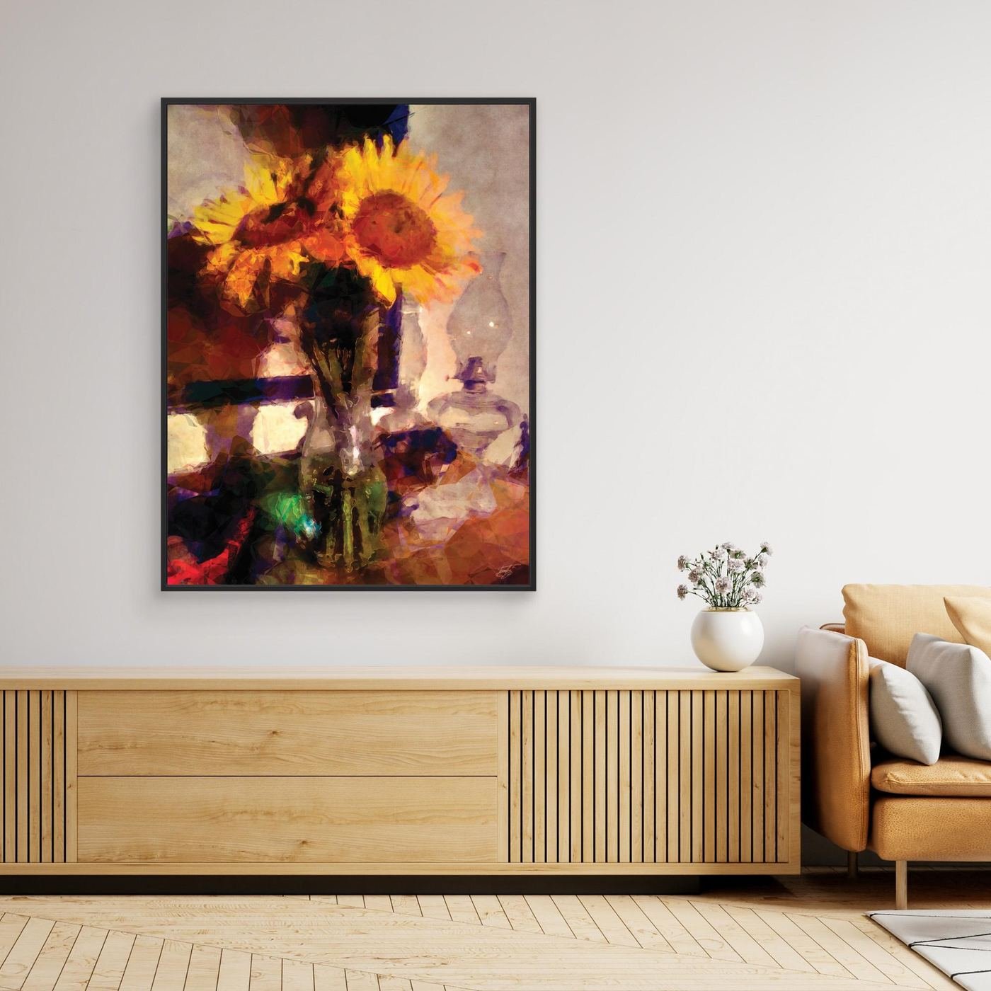 Fine art print depicting a rustic still life with vibrant yellow sunflowers in a vase next to a vintage glass kerosene lamp, featuring rich textures and warm orange and brown tones. Over console