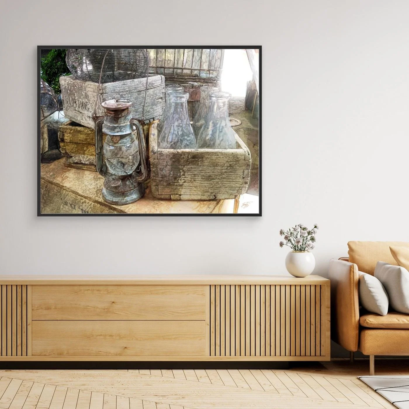 Vintage fine art print of an antique kerosene lantern, glass bottles in a rustic wooden crate, and weathered textures in warm neutral tones, framed and ready to hang. Over wooden console