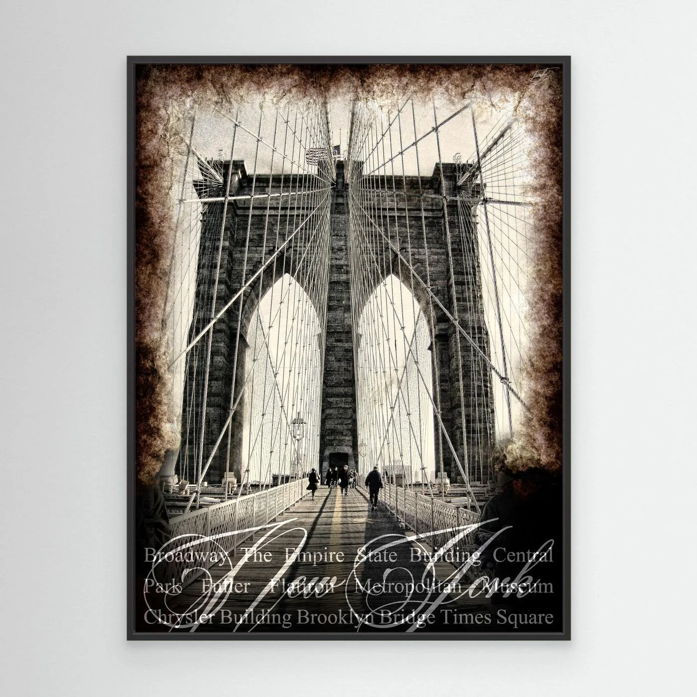Vintage fine art print of New York City of Brooklyn Bridge with a textured sepia background and elegant typography of NYC landmarks, framed and ready to hang. With black frame