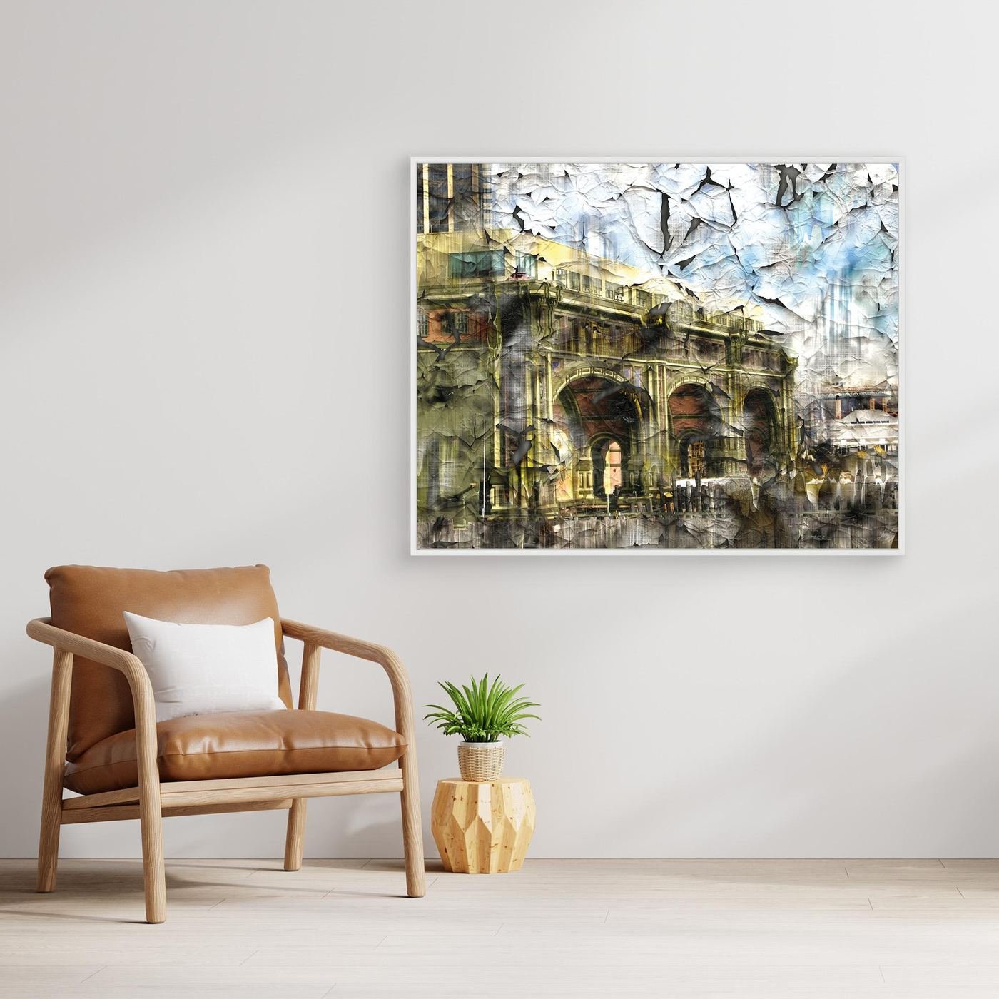 Abstract fine art print showcasing classical building arches with heavy cracked and distressed paint textures in gold, grey, and soft blue tones, framed and ready to hang. With chair