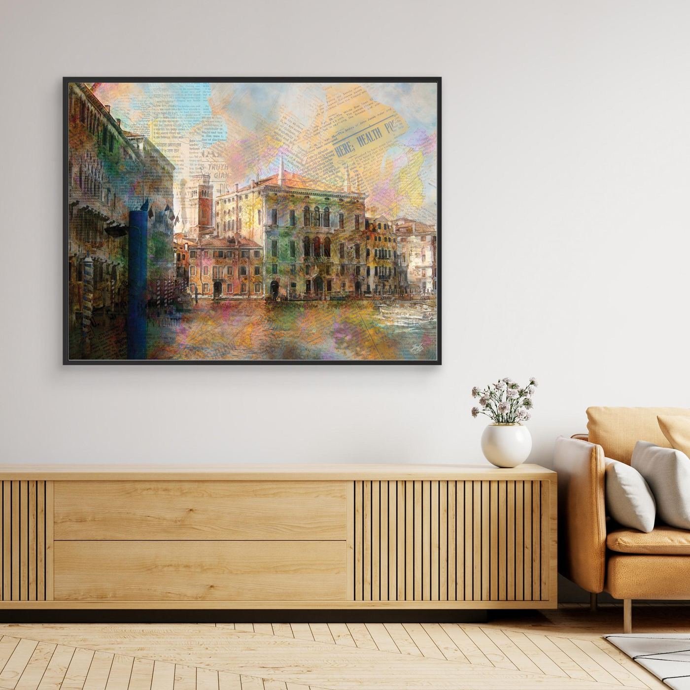 Fine art print collage of Venice featuring historic palazzo architecture overlaid with vintage newspaper clippings and vibrant watercolor textures, framed and ready to hang. Over wooden console