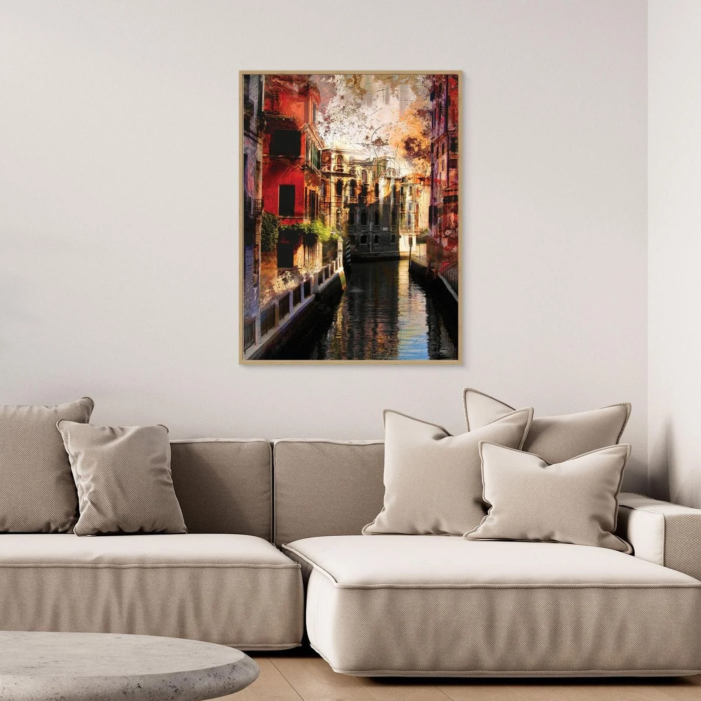 Abstract fine art print of a classic Venice canal landscape with heavy grunge textures, featuring historic architecture in vibrant red and gold tones, framed and ready to hang. Over grey couch