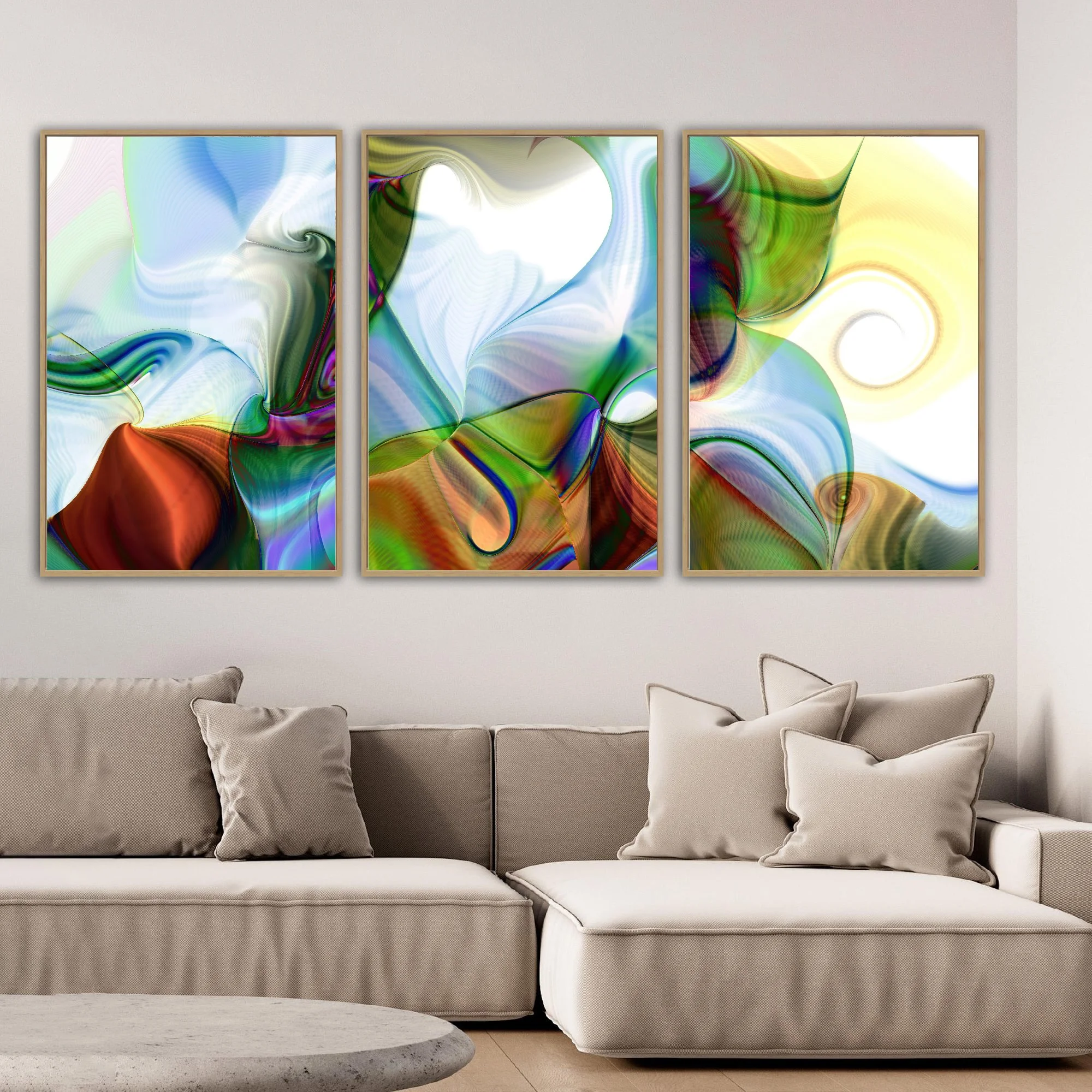 Abstract triptych with spiral patterns, line textures, and a color palette of forest green, sky blue, and warm earth tones over a white background, framed and ready to hang. Over grey couch