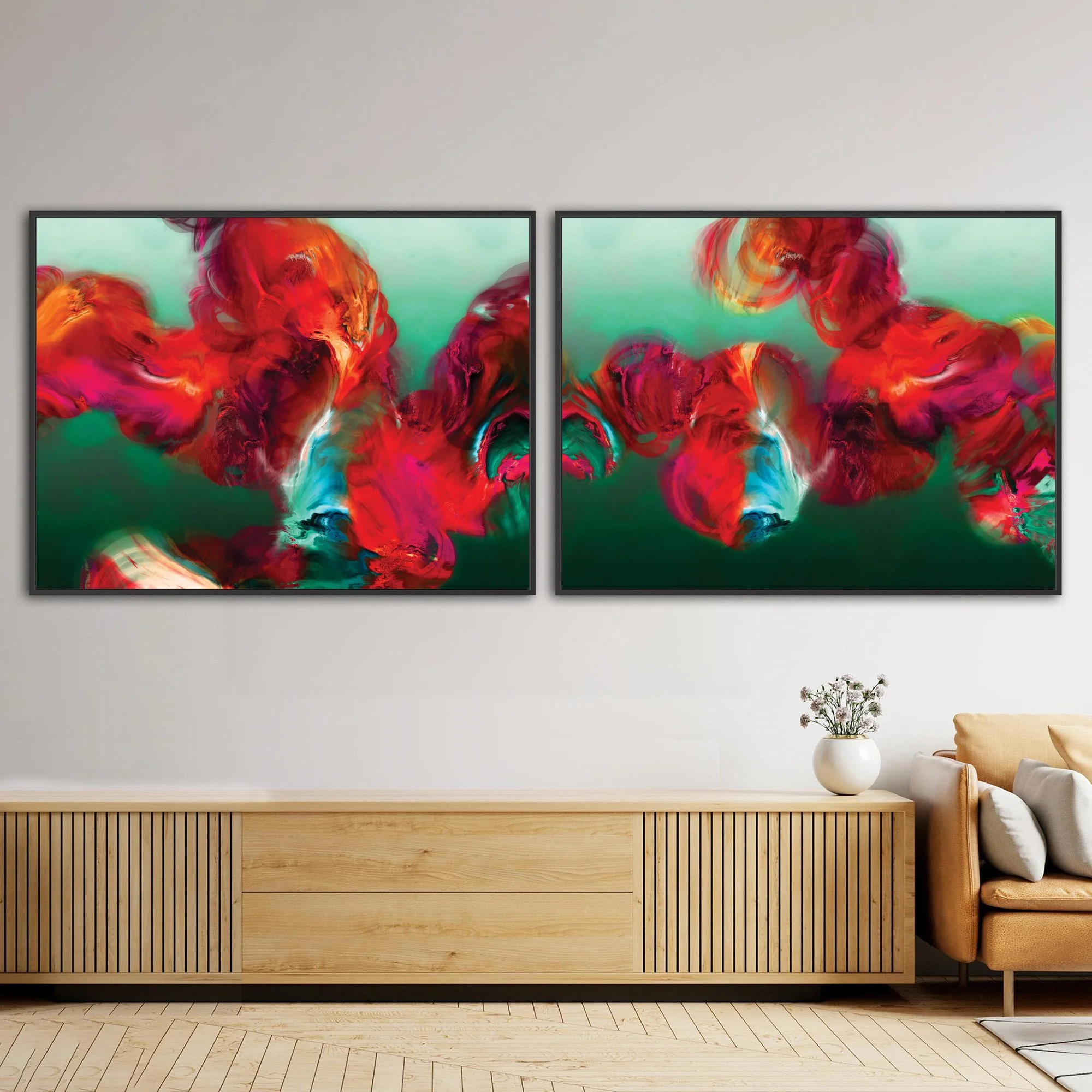 Abstract diptych with textured, cloud-like fluid shapes in fiery red, magenta, and bright ocher against a deep emerald green and teal background, framed and ready to hang. Over wooden console