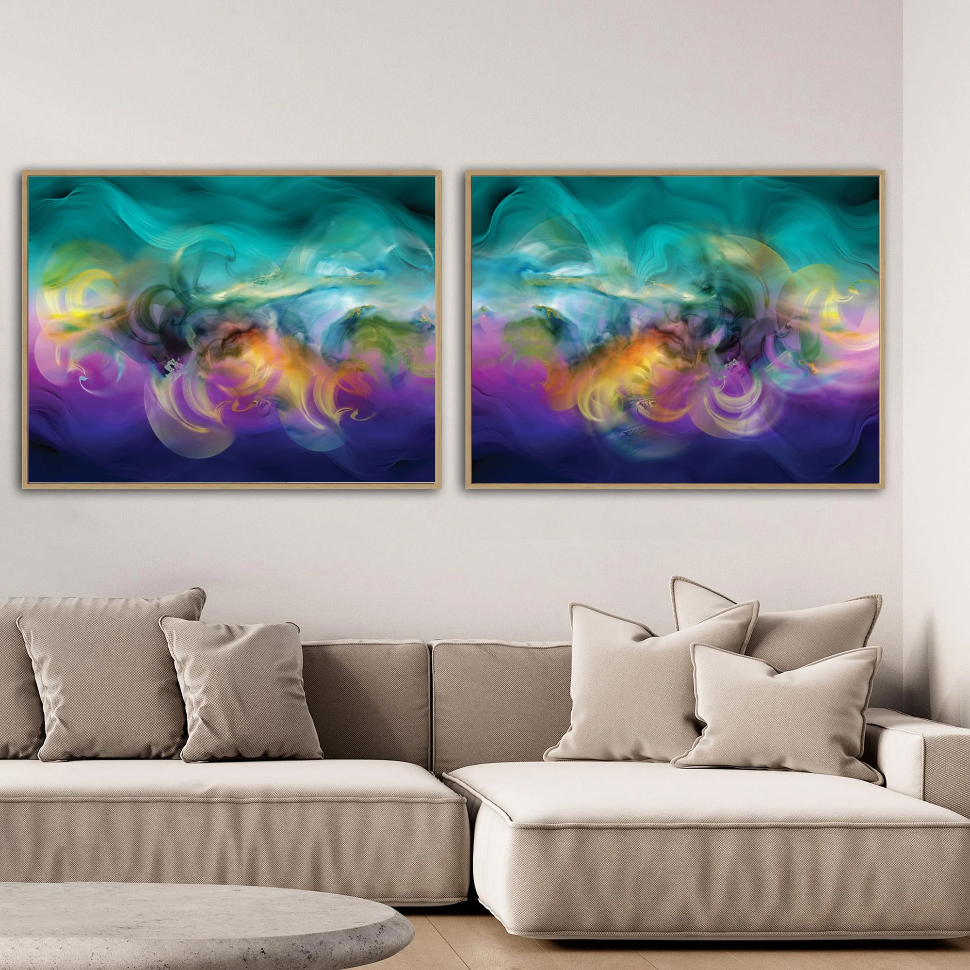 Abstract diptych with swirling fluid shapes and wave textures in teal, violet, and indigo blue, with glowing yellow and ocher center, framed and ready to hang. Over grey couch
