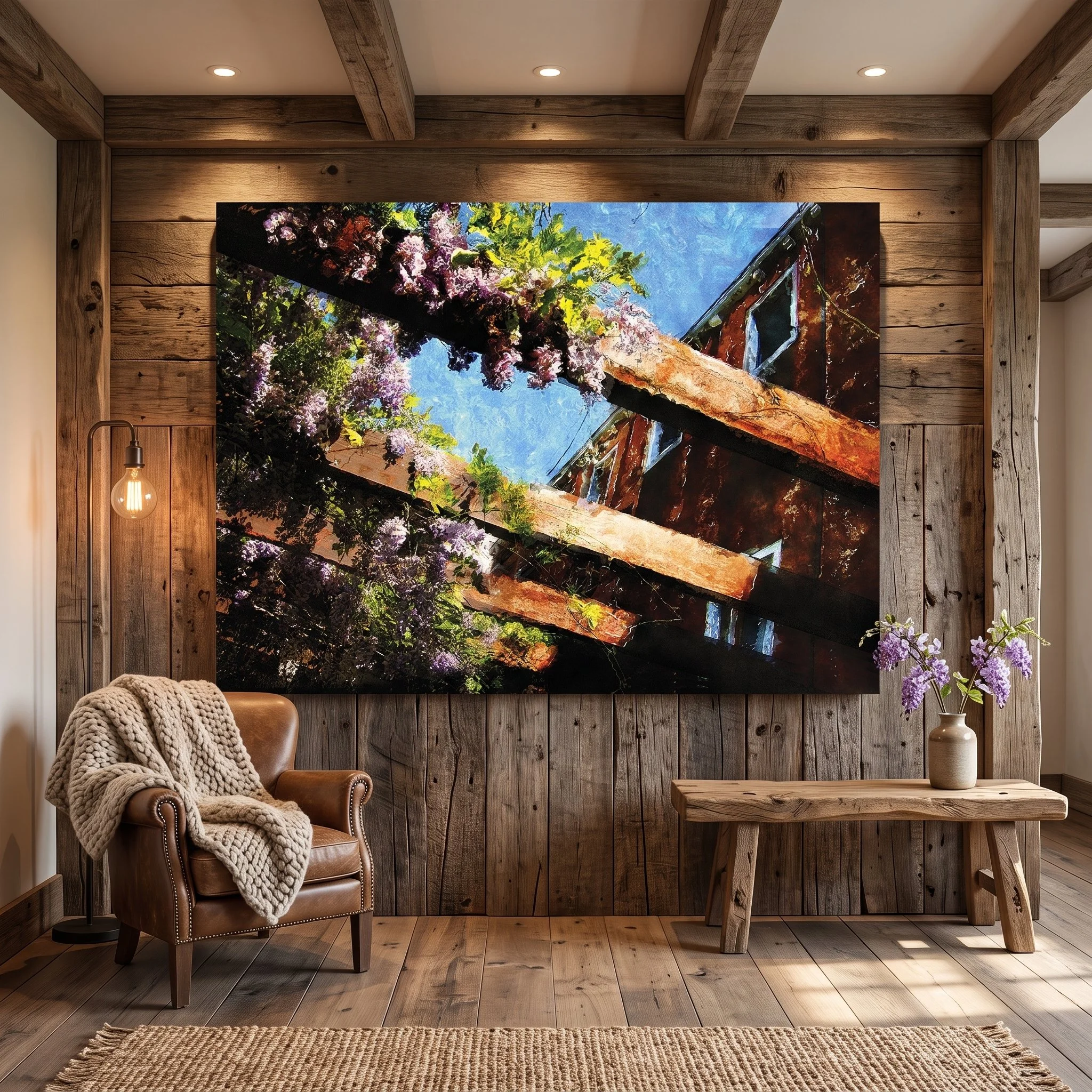 Large canvas art depicting a rustic architectural scene with wisteria hanging on a wood-paneled wall in a rustic cabin, featuring a leather armchair and wooden bench.
