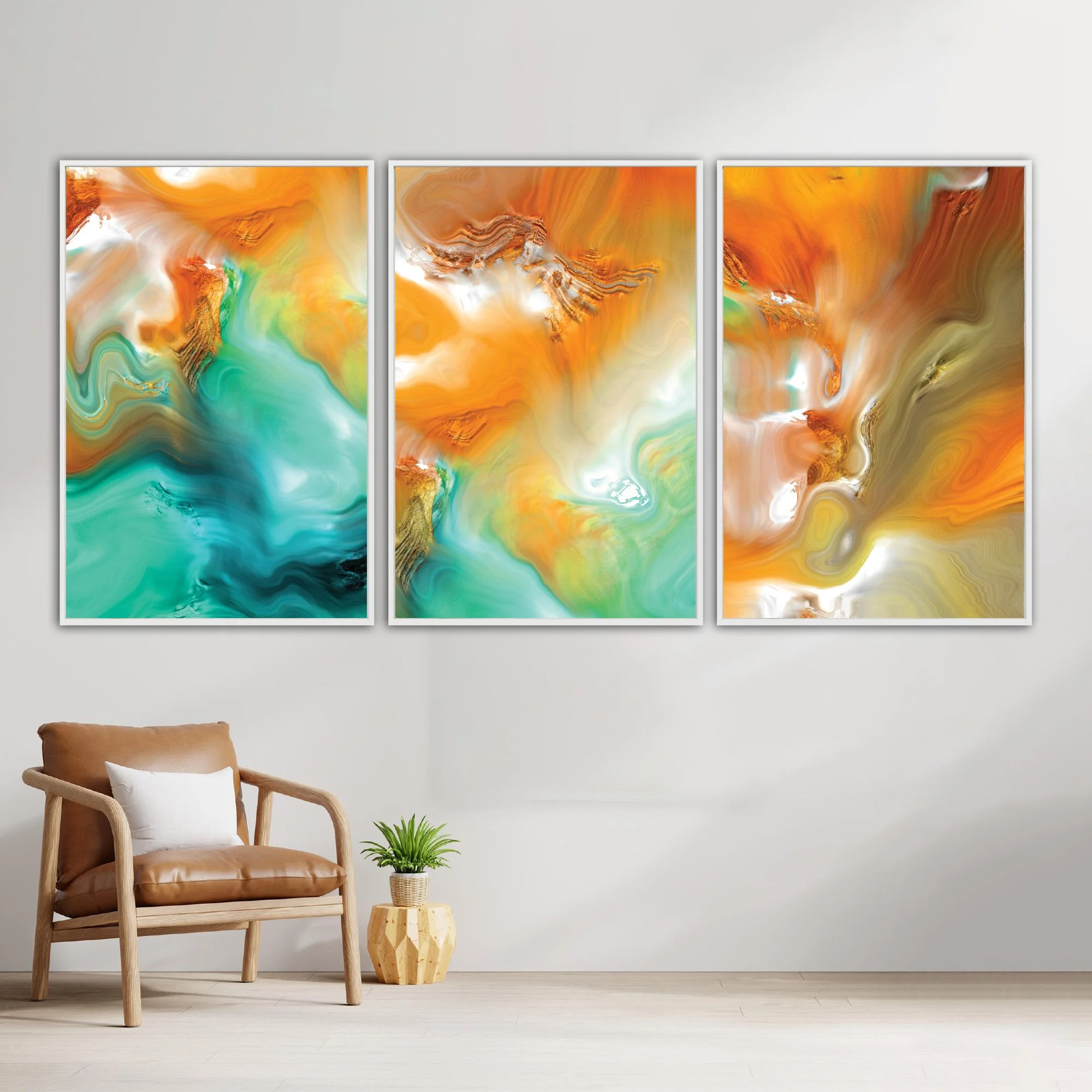 Abstract fine art triptych with flowing liquid marble textures in orange, ocher, and teal green tones, over a bright background, framed and ready to hang. With chair