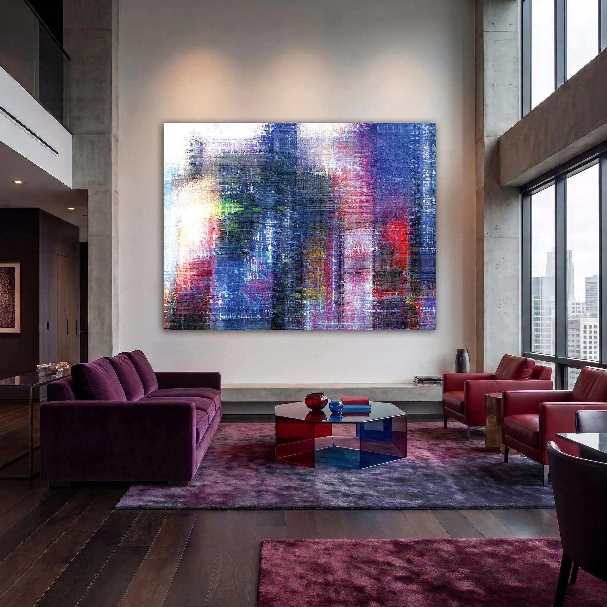 Giant abstract painting on the wall of a double-height penthouse with purple and red velvet sofas.