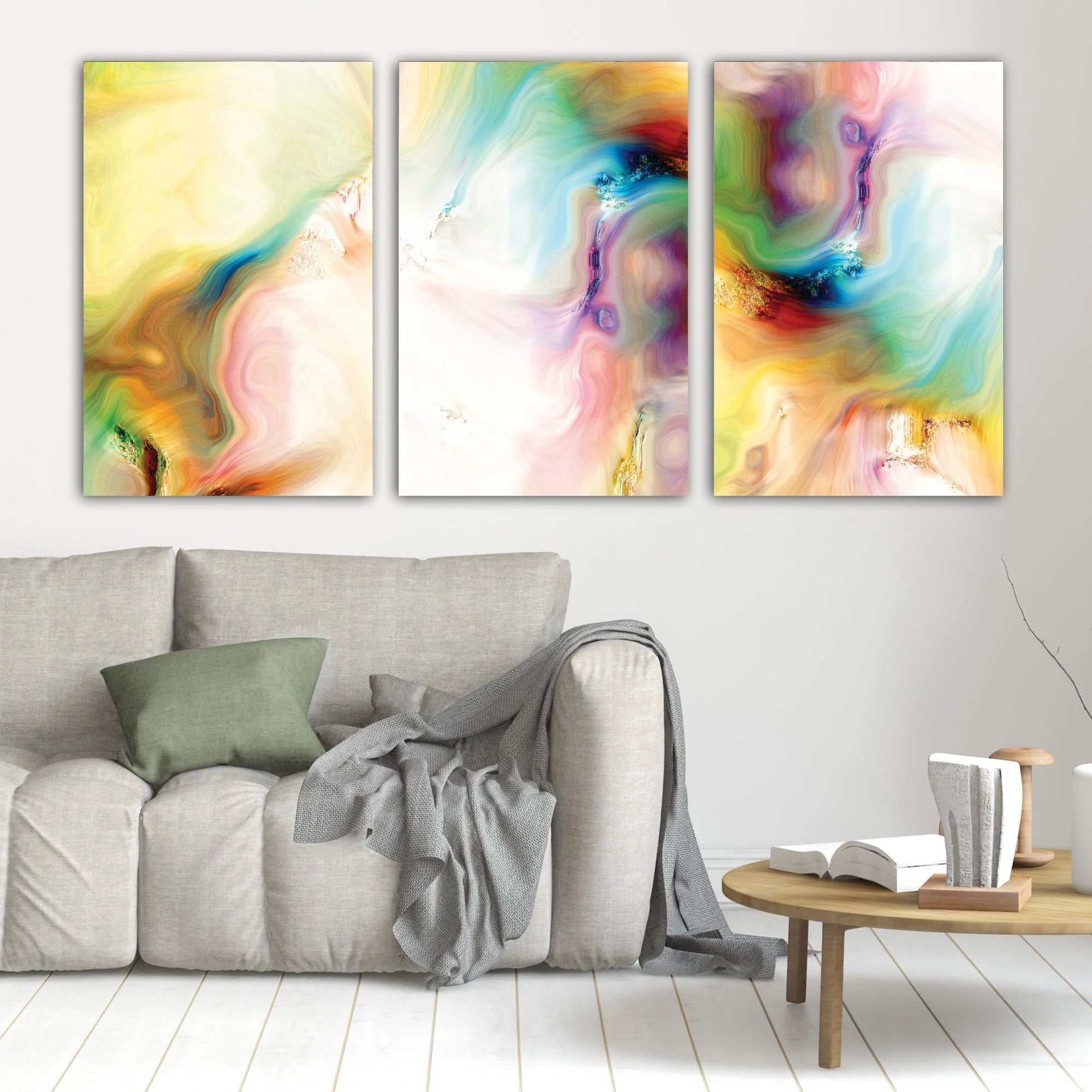 Abstract fine art triptych with textures and swirls in  yellow, green, turquoise, and pink with gold accents on a white background, framed and ready to hang. In living room