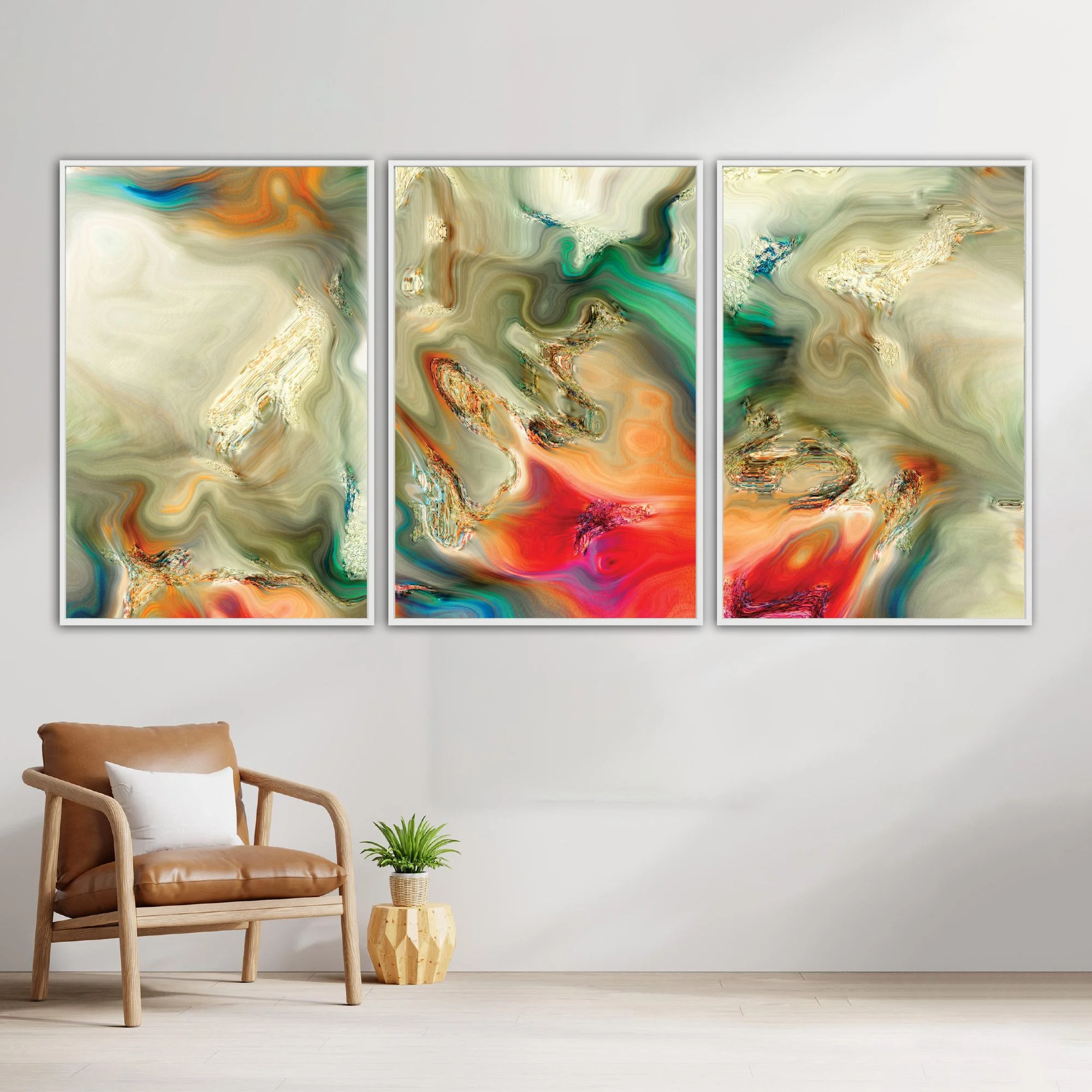 Abstract fine art triptych with liquid textures in earth tones, cream, and sage green, red and orange with metallic accents, framed and ready to hang. With chair