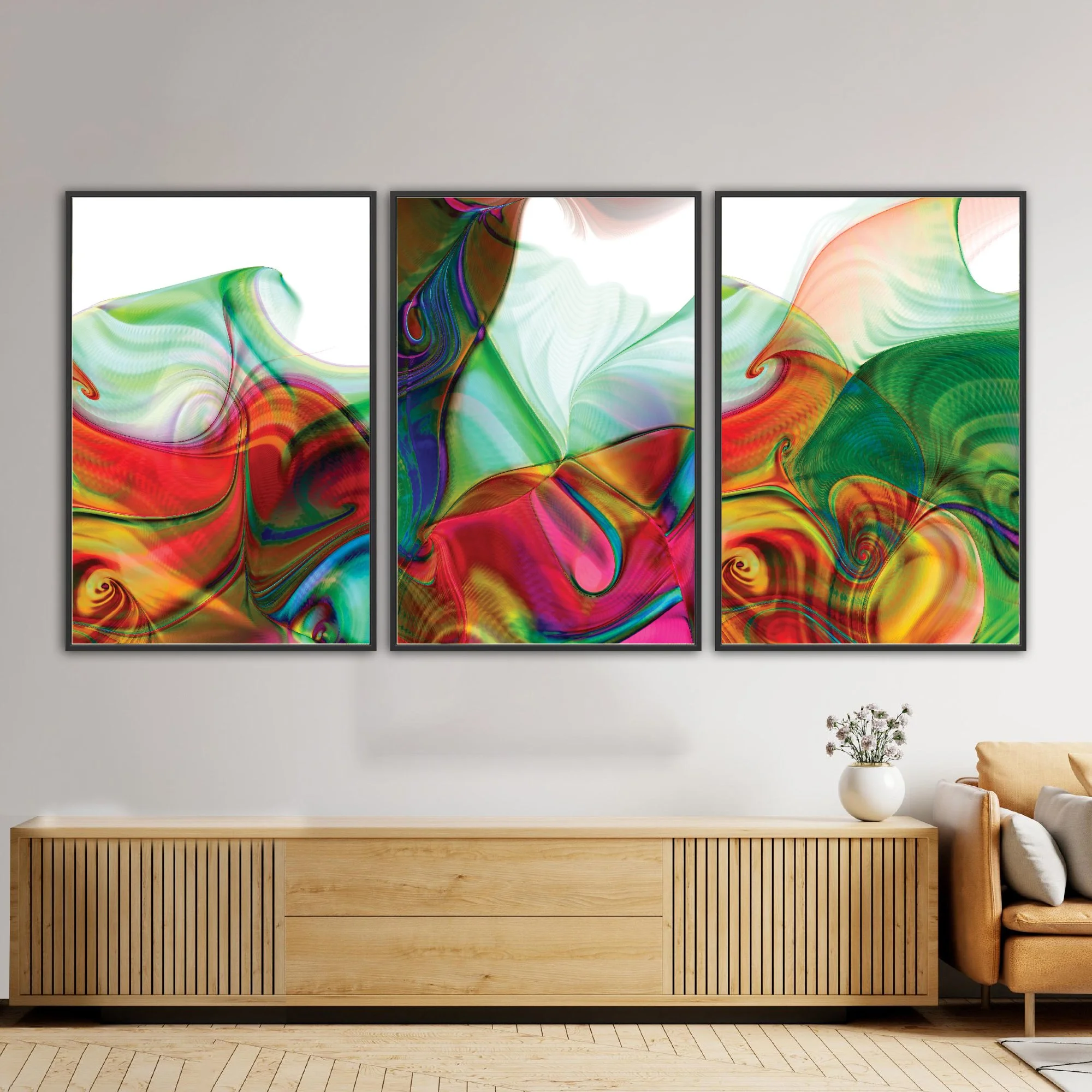 Abstract triptych with swirling fluid shapes and line patterns in vibrant crimson red, magenta, and emerald green over white background, framed and ready to hang. Over wooden console